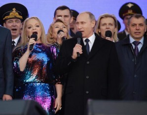 Putin sings at celebration.