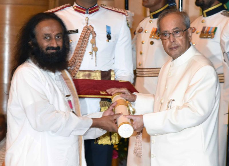 The President, Mr. Pranab Mukherjee presenting the Padma Vibhushan Award to Sri Sri Ravi Shankar, at a Civil Investiture Ceremony, at Rashtrapati Bhavan, in New Delhi on March 28, 2016.