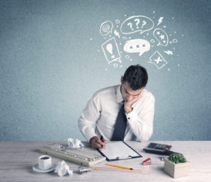 "preoccupied man at desk"